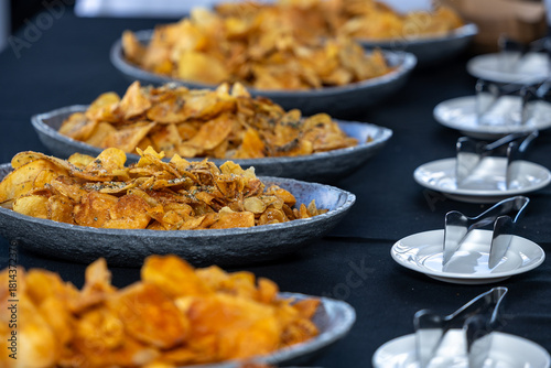 bowls of gourmet chips lined up on a table