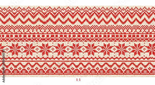 Red and white knitted pattern with zigzags snowflakes and geometric shapes in a horizontal arrangement