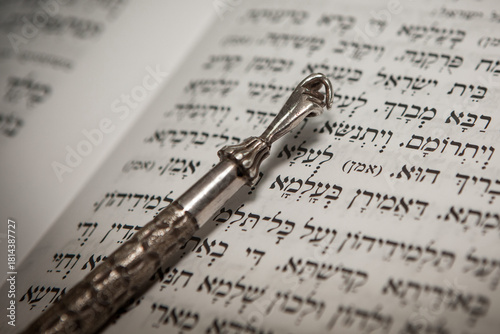 Yad pointer on Hebrew biblical text in Jerusalem synagogue
