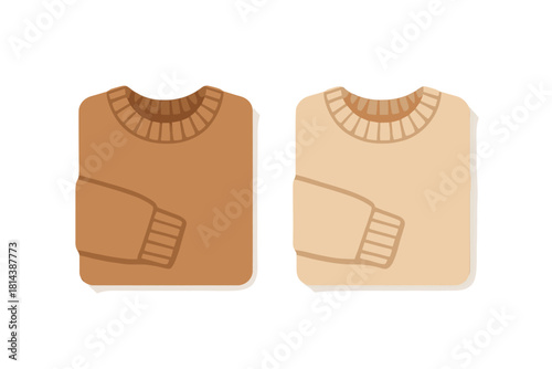 Two neatly folded crew neck sweaters in brown and beige neutral colors