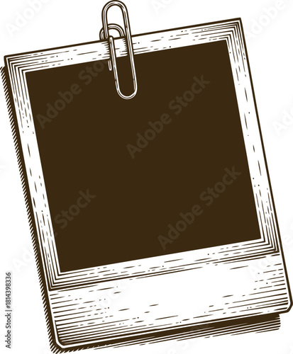 Engraving art vintage instant film photograph frame with blank dark center held by a metal paperclip, , engraved illustration style