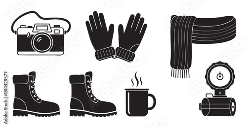 Collection of black and white vector icons for winter travel and outdoor adventure, including a camera, gloves, scarf, boots, a hot drink, and a thermos