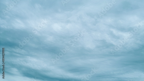 Overcast sky background with dramatic gray and white storm clouds.