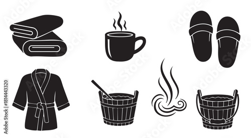 Set of black silhouette icons for spa, sauna, and wellness concepts, including a bathrobe, towel, slippers, hot drink, and wooden bucket