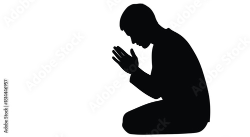 Silhouette of a man praying on his knees isolated on white background