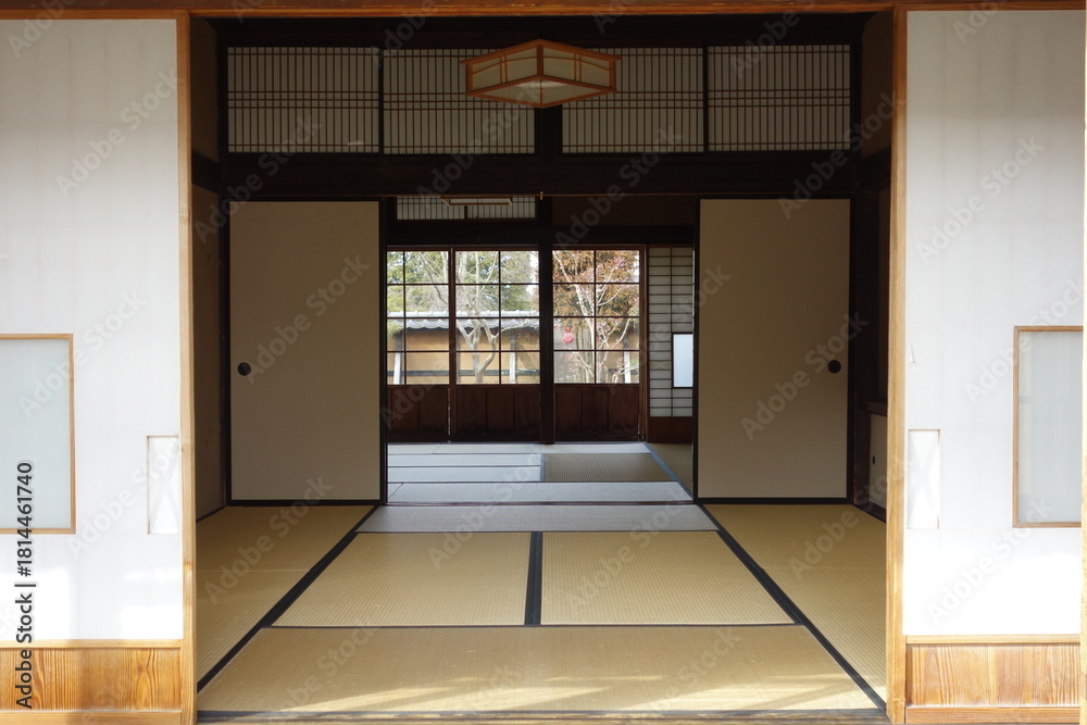 Fototapeta premium Traditional Japanese Tatami Room Interior with Sliding Fusuma Doors and Wooden Architecture