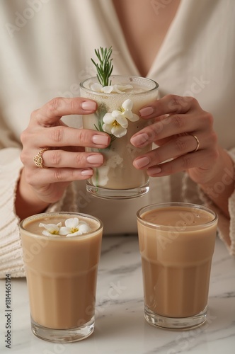 Coffee Drinks Served on a Marble Table With Floral Decorations in a Cozy Setting