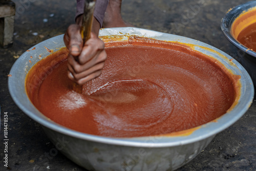 Close-Up of Artisanal Jaggery Production: The Final Mixing Stage