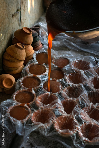 Texture and Sunlight: The Rich Brown Color of Jaggery in a Rustic Setting