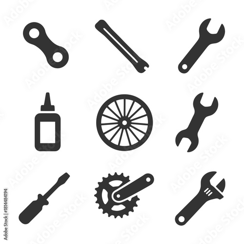 Bicycle repair tools and parts: wrenches, chain, wheel, gears, oil, screwdrivers.