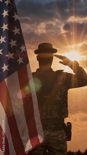 Silhouette of Military Salute of soldier for memorial day against flag at sunset