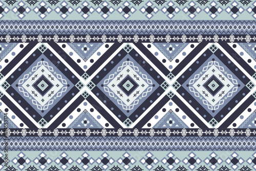 Timeless ethnic geometric pattern featuring intricate diamond motifs & traditional borders in sophisticated blue-white palette.