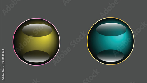 Two glossy orbs with gold and pink rims on gray background