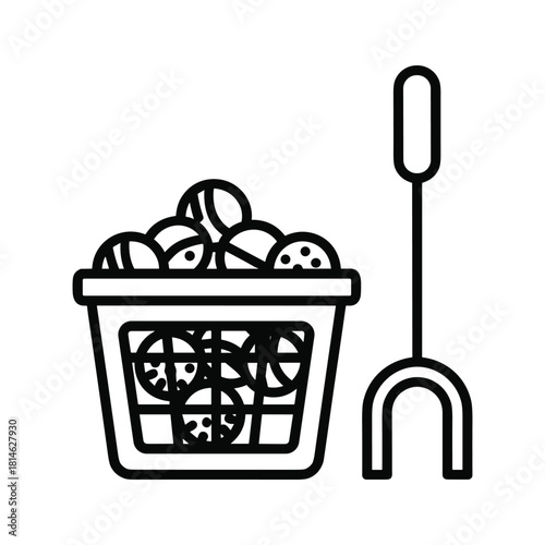 Basket full of tennis balls and ball picker isolated on