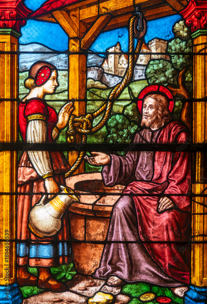 Obraz premium Stained (19th century) glass of Jesus and the Samaritan woman at the well.