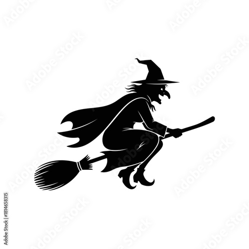 Black silhouette of a witch flying on a broomstick with a pointed hat and flowing cloak