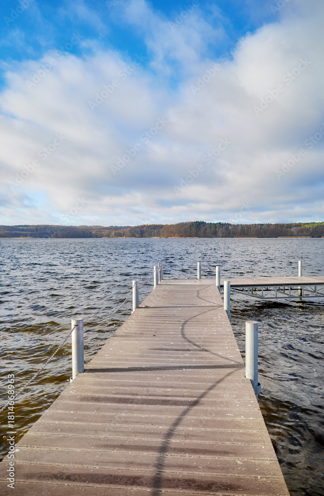 Fototapeta premium Pier on Lake Charzykowskie in autumn, Charzykowy, Poland.