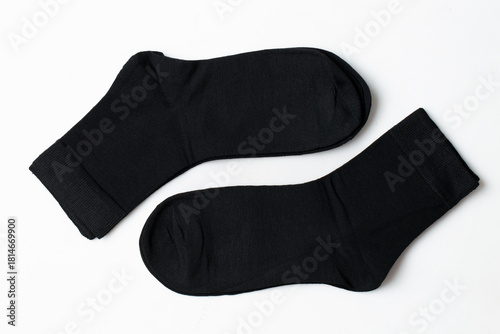 Black socks on a white background Casual clothing.