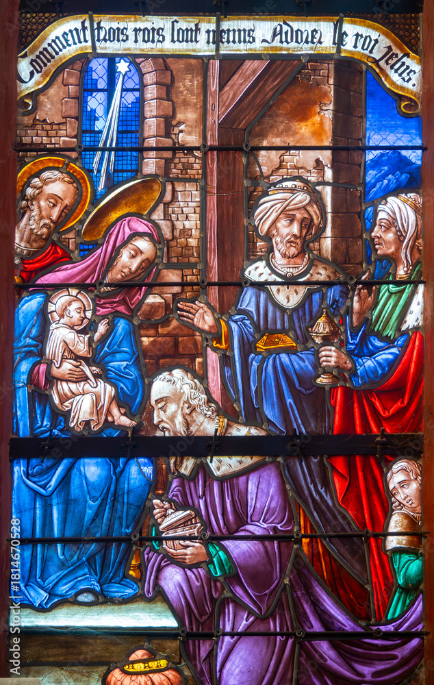 Obraz premium Stained glass (16th century) of Christmas Nativity Scene : Adoration of the Magi as they present gifts of gold, frankincense and myrrh to the Infant Jesus.