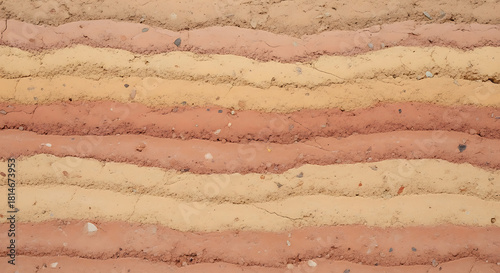 Layered earthy tones in a textured rammed earth wall background
