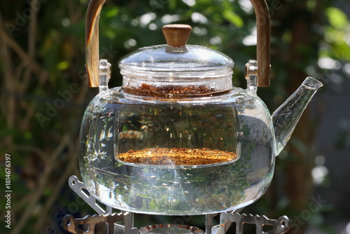 Aromatic Black Tea Brewing with Visible Tea Leaves