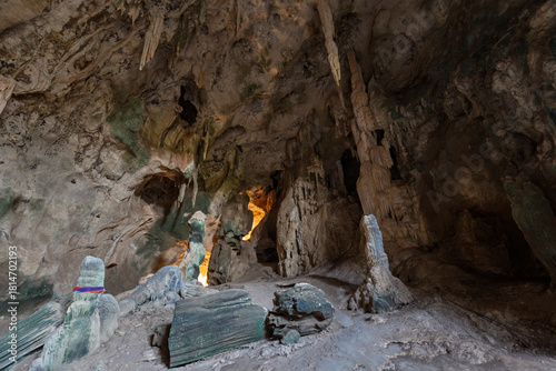 Inside the tall and scenic Khao Khanampnam (Khanap/Khanab Nam) Cave with a tall stalagmites and stalactites in Krabi Town, Thailand.