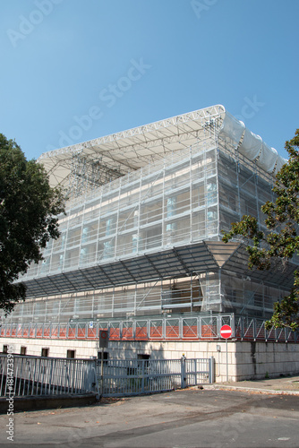 Scaffolding on the roof of a construction site to protect workers from the sun's rays and heat, Rome, Italy.
