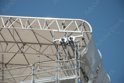Scaffolding on the roof of a construction site to protect workers from the sun's rays and heat, Rome, Italy.