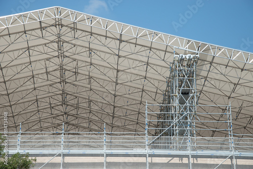 Scaffolding on the roof of a construction site to protect workers from the sun's rays and heat, Rome, Italy.