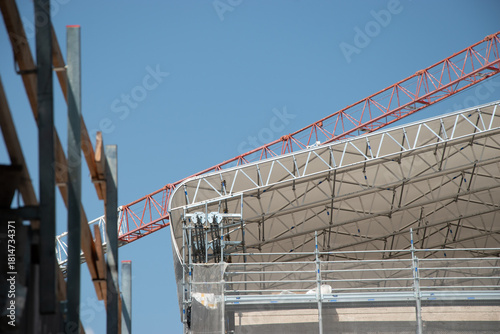 Scaffolding on the roof of a construction site to protect workers from the sun's rays and heat, Rome, Italy.