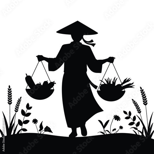 Traditional asian farmer silhouette with conical hat carrying fresh produce in shoulder baskets on rural path with plants
