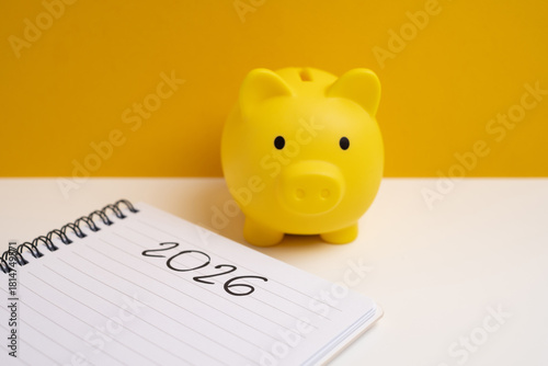 Happy New Year 2026 and piggy bank. Goals, plans, actions, savings, pension fund, investments. Financial concepts