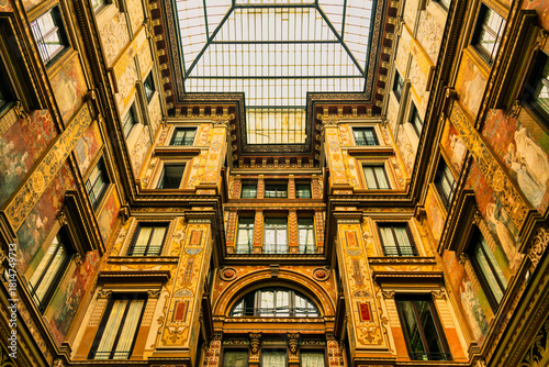 The photograph captures an interior shot of a magnificent building, likely a palazzo or historical hotel, showcasing a stunning architectural interior. T