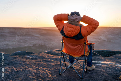 Enjoying a serene sunset view from a mountain top
