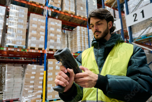 Warehouse worker scanning inventory in cold chain storage