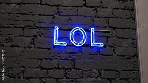 Blue neon lol text glowing on dark brick wall, modern slang abbreviation for laughter and humor concept in social media communication