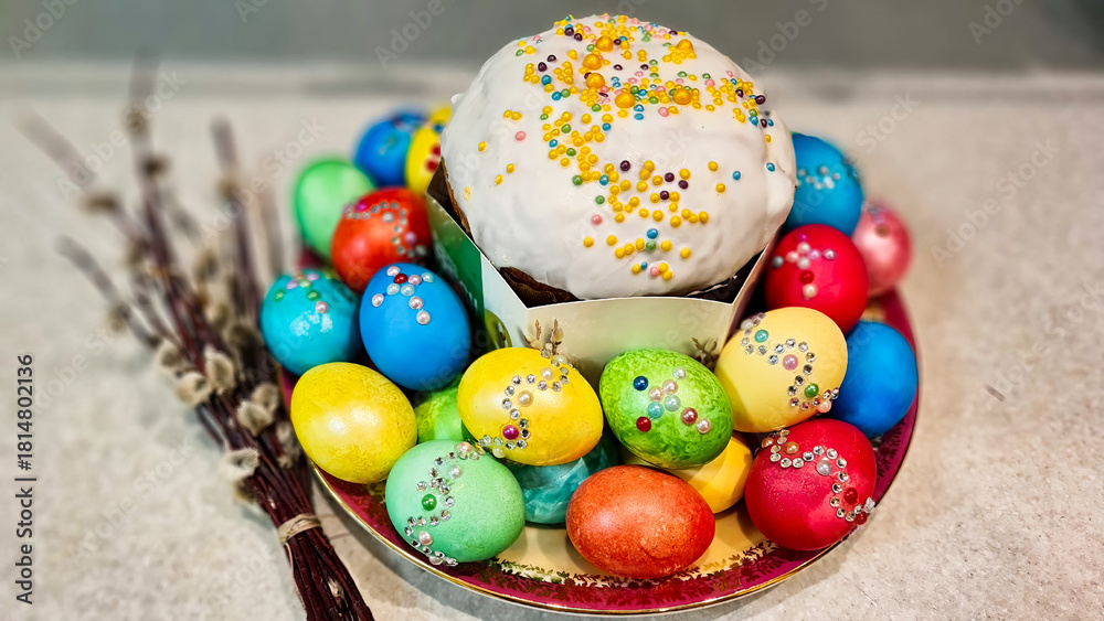 Fototapeta premium A plate of Easter eggs with a cake on top