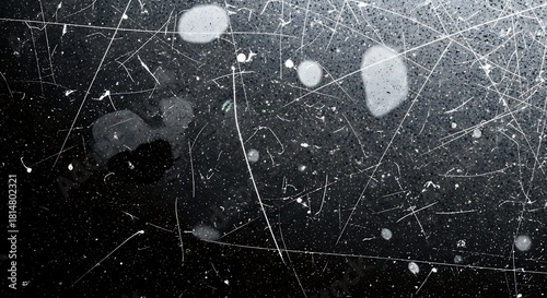 Abstract scratched metal surface with water droplets and smudges