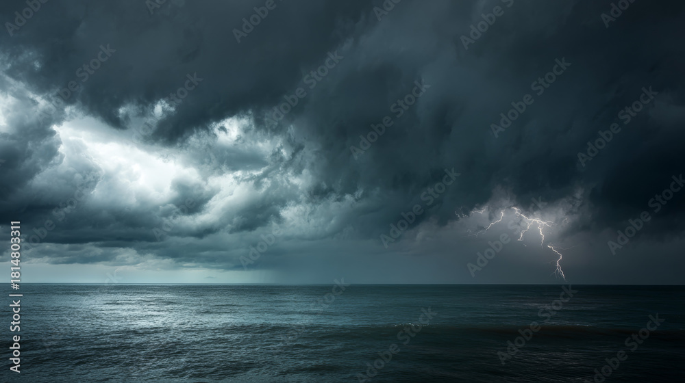 Fototapeta premium Stormy sea under dramatic gray skies lightning on the horizon.