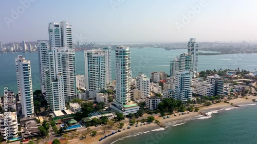 Aerial drone view of Bocagrande beachfront skyscrapers and Caribbean Sea in Cartagena Colombia sunny day