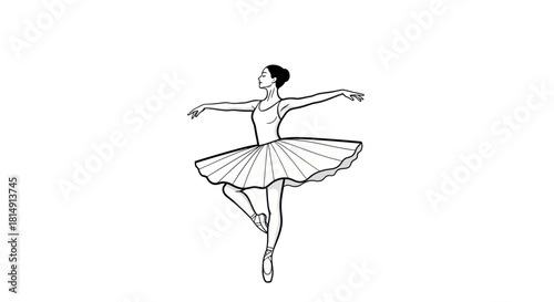 Elegant ballerina in a graceful pose on pointe shoes.