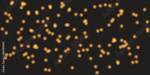 Abstract background of glowing orange lights scattered on a dark background