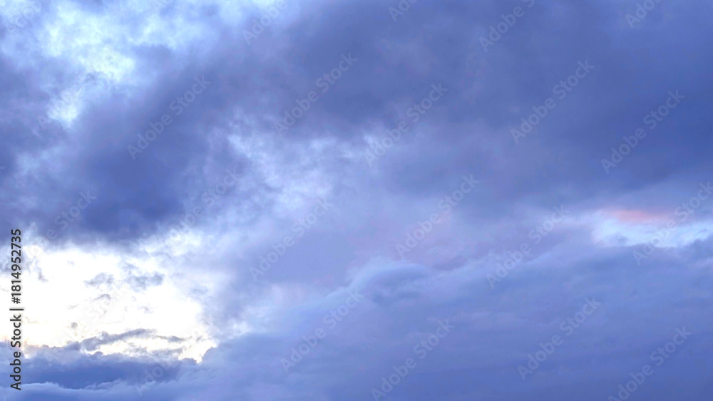 Obraz premium Pink cloud on a purple cloudy sky background