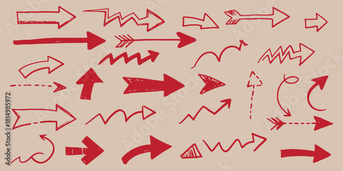 Collection of red hand drawn arrows pointing in different directions on light background
