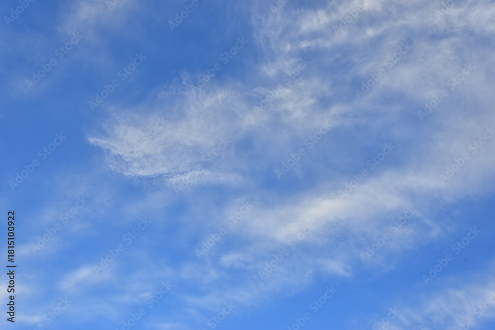 Fototapeta premium Clouds floating in clear blue sky
