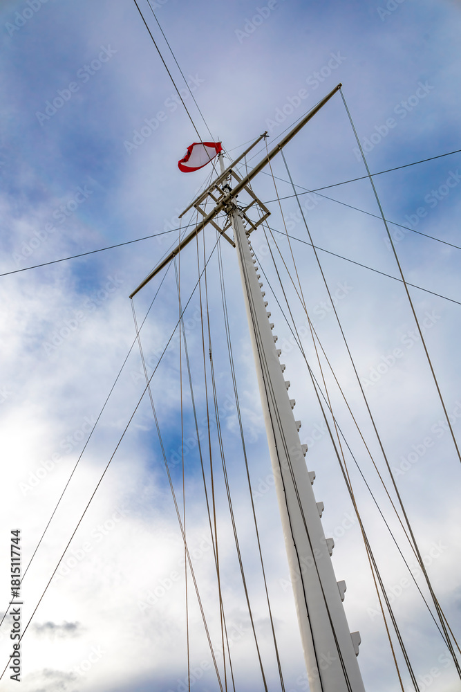 Fototapeta premium Iconic flag mast on Halifax Citadel, symbolizing maritime heritage against a dramatic sky.