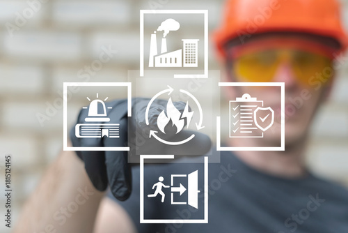 Emergency preparedness plan industry concept. Engineer using virtual touch screen presses the button of fire with lightning symbolizing: emergency plan. Checklist to do in disaster.