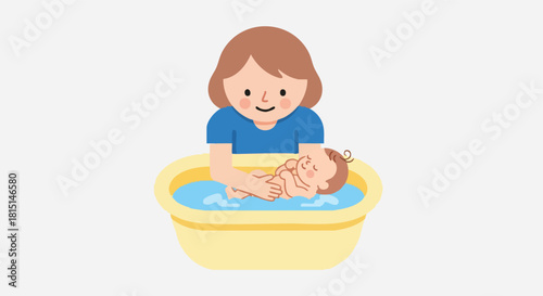 A smiling parent carefully bathes their happy newborn baby in a small, yellow infant tub.