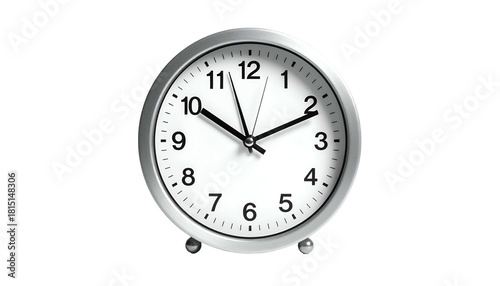 Silver alarm clock with white face showing 1058