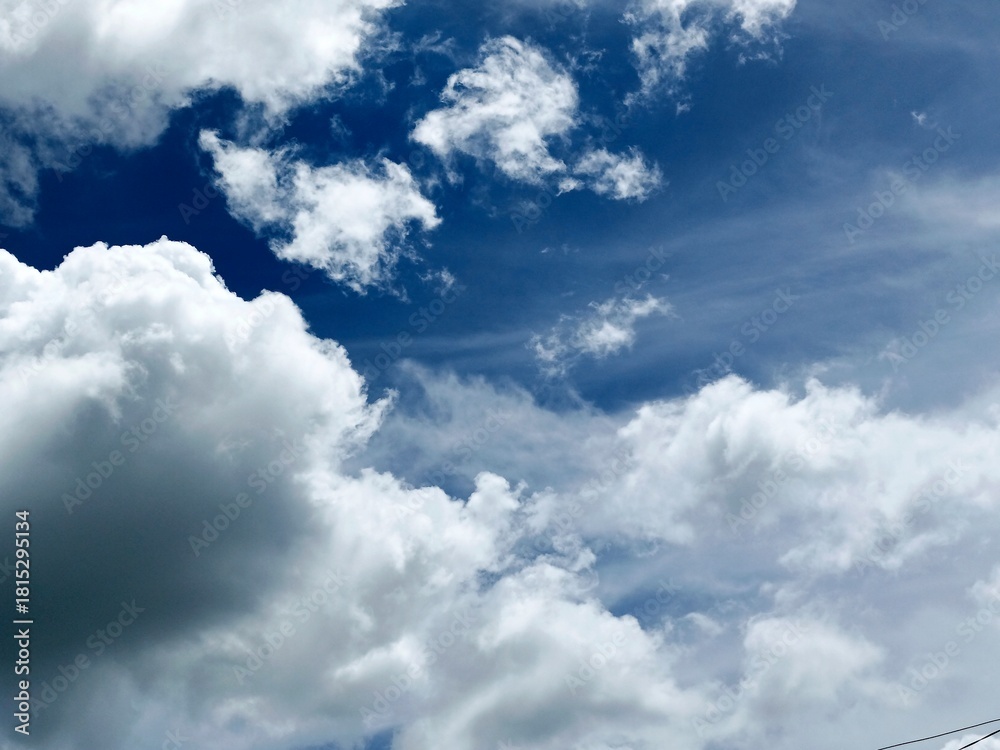 Obraz premium Dramatic Blue Sky with Bright Clouds